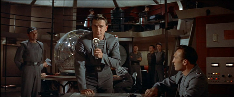 Forbidden Planet - Commander Adams (Leslie Nielsen) addresses the crew of the spaceship.