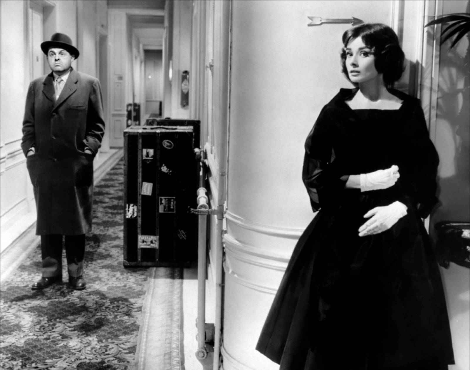 John McGiver as Monsieur X and Audrey Hepburn as Ariane